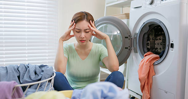 istock housewife Overwhelmed by Laundry 2216981497