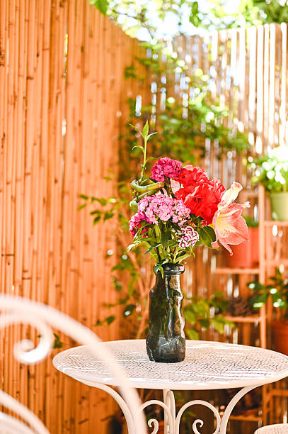 istock Colorful bouquet standing on a white metallic table in a garden 2216986785