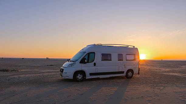 istock Scenic sunset over sandy beach with camper van in Denmark showcasing coastal adventure 2216988502