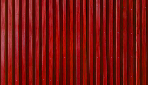istock uniformly textured surface composed of numerous parallel, abstract red wooden slats arranged vertically, creating a clean and simple pattern. 2216994896