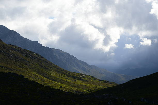 istock Serene South African Countryside Landscape with Green Fields and Distant Rolling Hills and mountains 2216996481