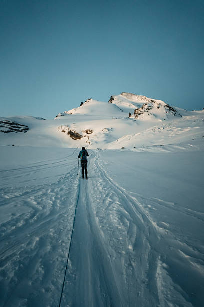 istock Ski mountaineer and ski tracks on glaciated mountain 2216998837