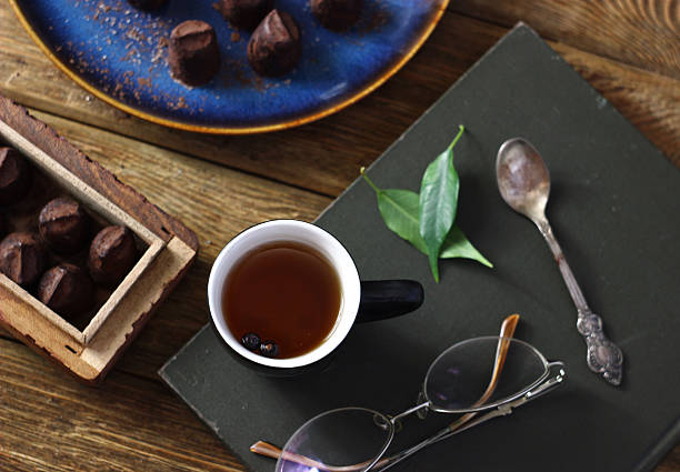 istock a cup of black tea and truffle candies 2217002097