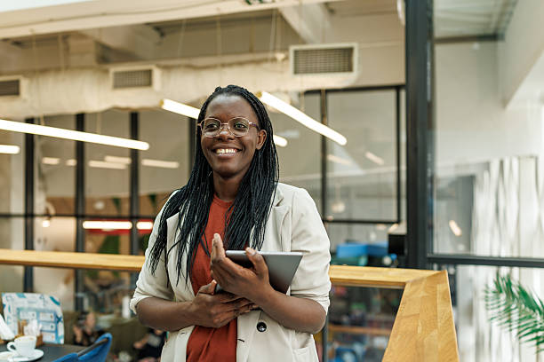 istock Black Woman in Tech Workspace with Confident Smile 2217002648