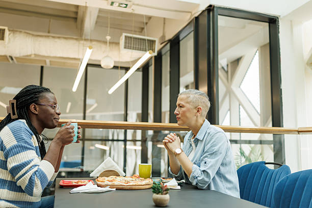 istock Diverse women having a lighthearted meal in a stylish eatery 2217002859