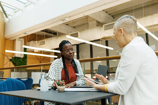 istock Smart Working Women Sharing Ideas in Urban Workspace 2217003005