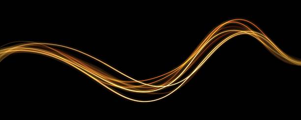 istock Golden glowing shiny spiral speed lines yellow light effect. Curved bright line of light for holiday banners. Glittering wavy trail. 2217008314