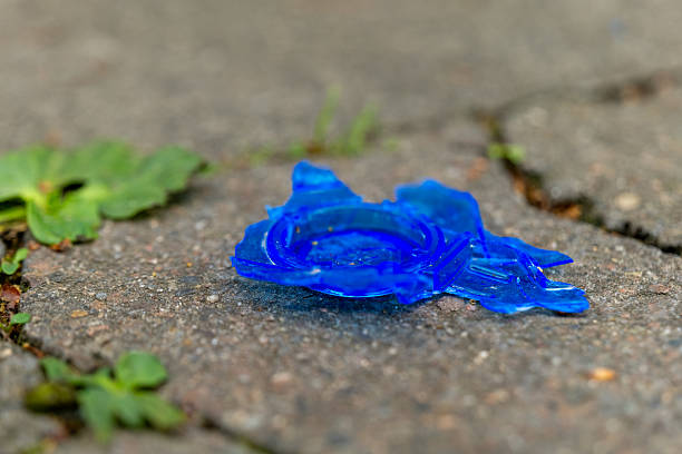 A conceptual image of a baby bottle filled with Euro banknotes, placed against a blue background. The photo symbolizes the cost of raising a child, financial planning, and family expenses, with a modern and thought-provoking theme.