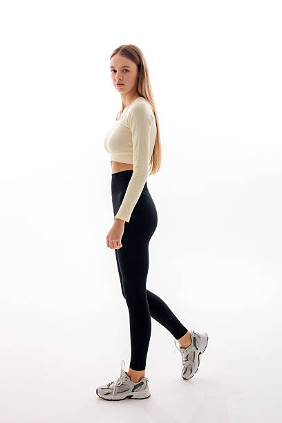 istock Model posing in stylish activewear against a bright background with a confident expression 2217013394