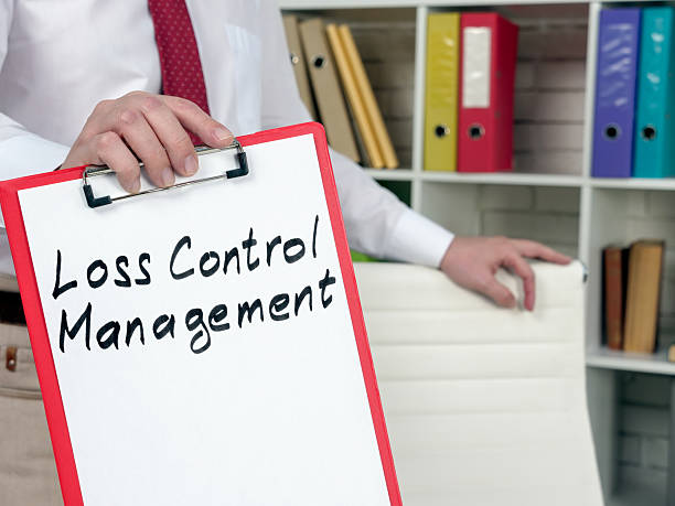 istock A manager shows red clipboard with loss control management. 2217013813
