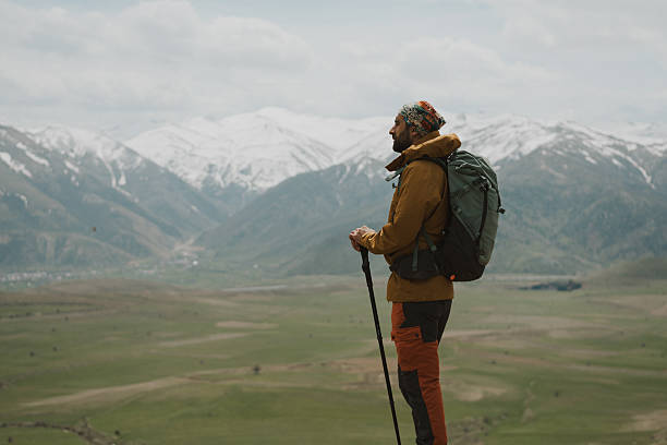 istock Hiker contemplating breathtaking mountain view in spring 2217017111