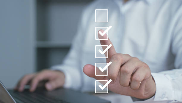 istock A hand pointing to virtual checkboxes on a digital screen. Concept of checklist, approval process, quality control, task management, and workflow system. 2217028542