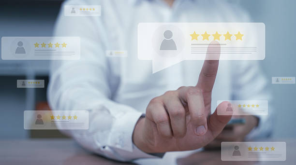 istock A hand pointing to a 5-star customer review icon on a virtual screen. Concept of user experience, satisfaction, feedback rating and CRM system in digital business. 2217028556