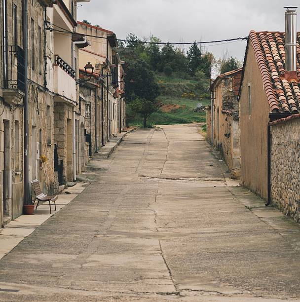 Narrow brown streets with close old houses in the village of Caleruega, Burgos.