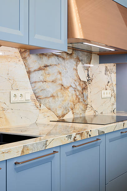 istock An Elegant Modern Kitchen Featuring Stunning Marble Countertops and Beautiful Blue Cabinets 2217031396