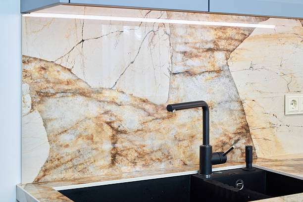 istock This elegant kitchen features a marble backsplash with modern fixtures, enhancing comfort and style 2217031601