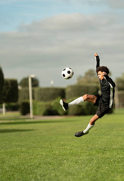 Teenager training soccer field in Vila Nogueira de Azeitão in Setubal, Portugal