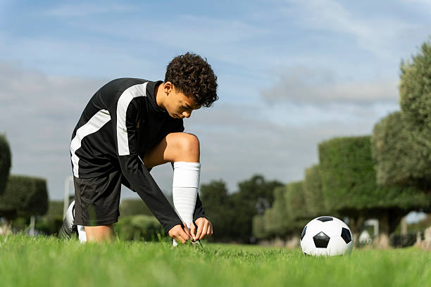 Teenager training soccer field in Vila Nogueira de Azeitão in Setubal, Portugal