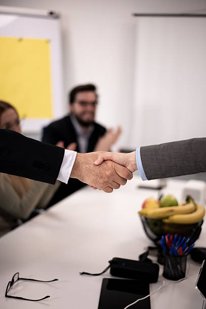istock Professional handshake during a business meeting in a collaborative office setting 2217040443