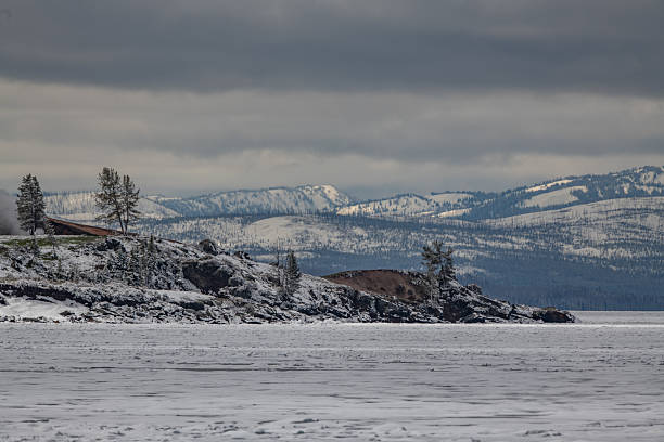 Steamboat point and ice covered lake Yellowstone around it, in Yellowstone National Park, in Wyoming, United States.