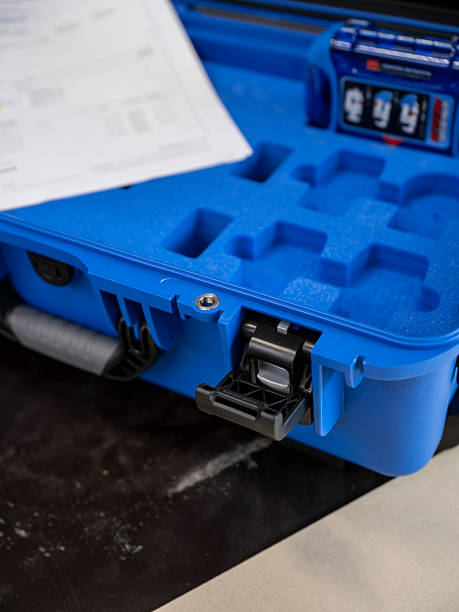 Blue waterproof equipment case with molded foam compartments and secure latches