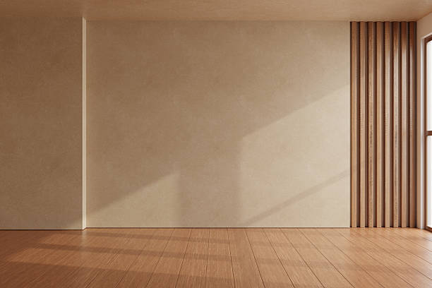 istock Empty beige wall with wooden floor and sunlight shadow- 3D rendering 2217048895