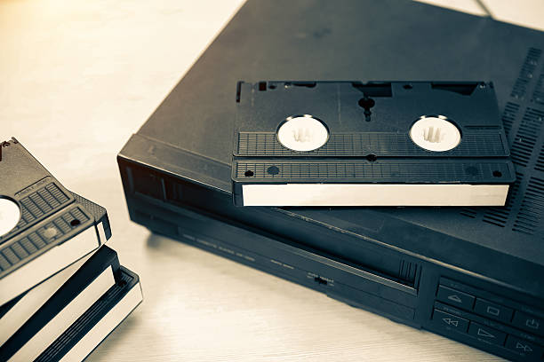 istock Video cassette tape VHS old retro style stack with video record playback concept of vintage electric and electronic appliances multimedia player device old fashioned. 2217052916
