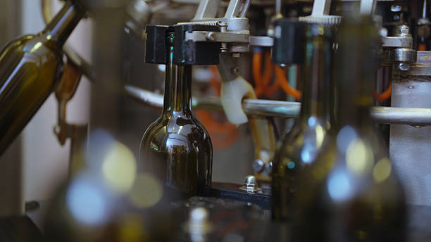istock Filling wine bottles on a conveyor belt at a winery 2217054007