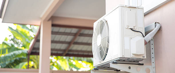 istock Air compressor, Close-up external split wall type of outdoor home air conditioner unit installed on outside building. Concepts of cool or heat or hot and air conditioning system maintenance. 2217054129