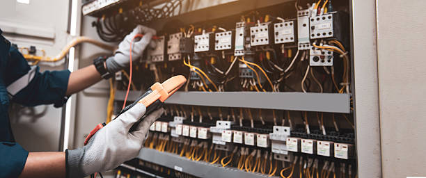 istock Electricity and electrical maintenance service, Engineer using measuring equipment tool checking electric current voltage at circuit breaker terminal and cable wiring main power distribution board. 2217054362