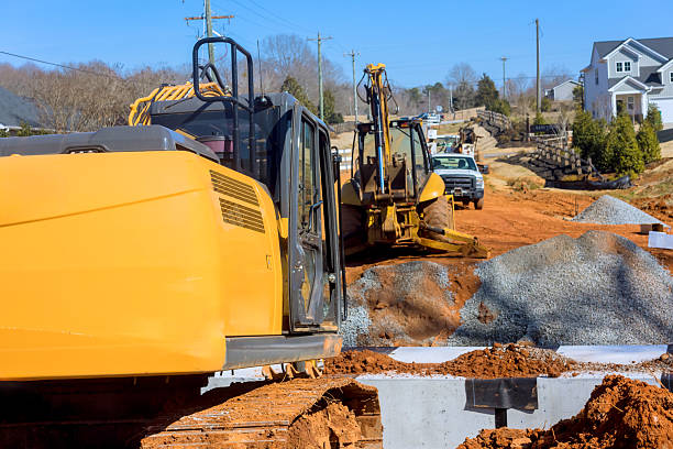 istock Construction equipment working on residential site during land clearing in suburban neighborhood 2217056110