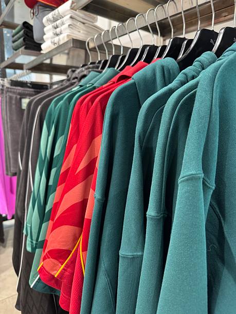 istock New cloths Tshirts hanging in the cloth store 2217057265