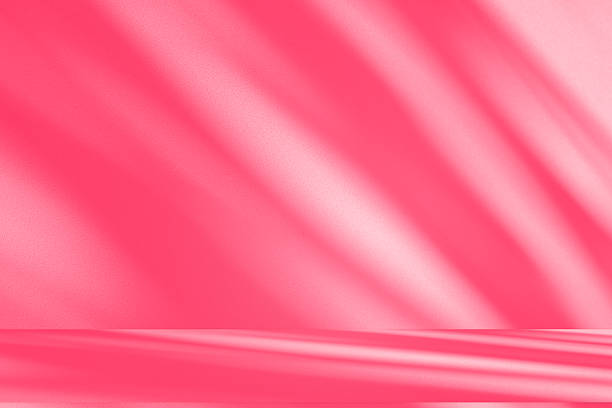 istock Wall interior background, studio, and backdrops show products. with shadow from window color white and pink light. background for text insertion and presentation of product 2217058623