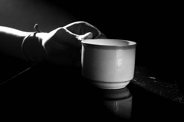 Hand Holding a Cup in Dim Light, Hand Holding a Cup in the morning