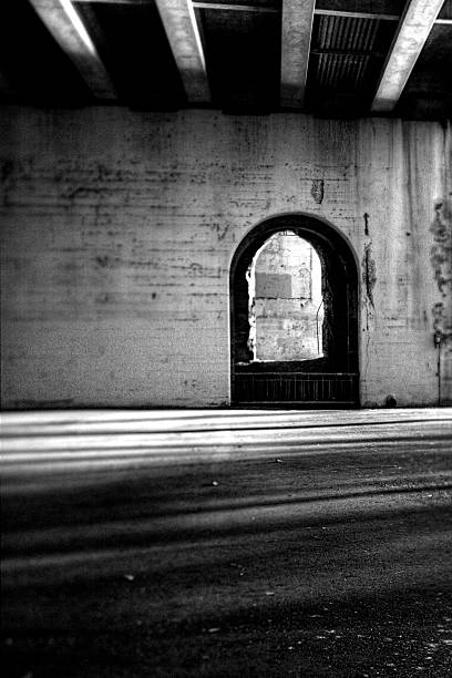 istock Arched Window Beneath Urban Overpass in Black and White 2217060140