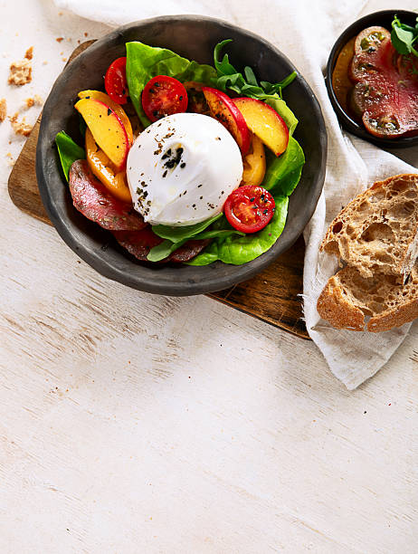 istock Salad with burrata cheese, lettuce and tomatoes 2217060976