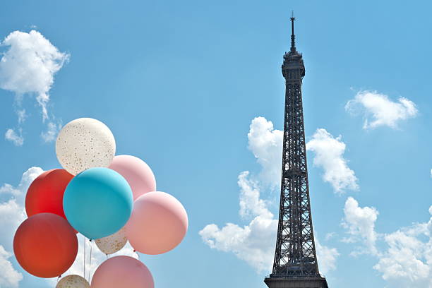 Paris,France - May 14, 2025: Colorful Balloons and le Tour Eiffel on blue sky background