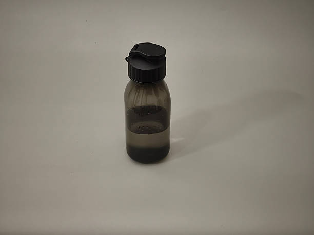 A black tumbler filled with plain