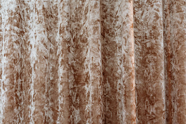 Soft textured fabric in warm brown shades displayed in close-up view