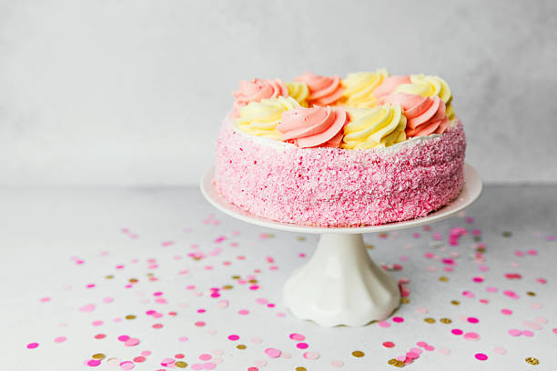 Beautiful pastel birthday cake adorned with colorful frosting roses
