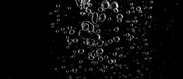 istock Underwater bubbles, Underwater oxygen design concept, Small water drops underwater, On black background, Close-up photography. 2217068323