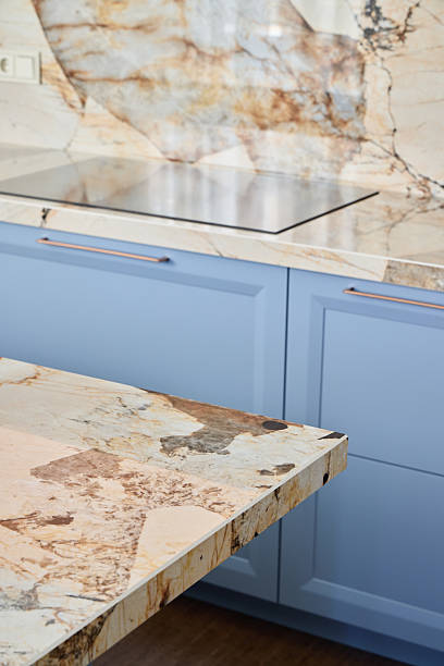 istock Discover an Elegant Kitchen Design Featuring Stunning Marble Countertops and Beautiful Blue Cabinets 2217068763