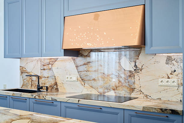 istock Stylish Blue Kitchen Featuring Elegant Marble Accents and a Modern Design Aesthetic 2217068935
