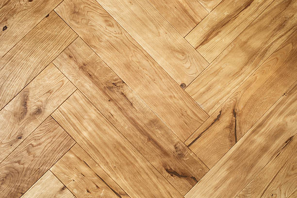 istock Natural wooden oak parquet flooring background. Rustic floor pattern for interior and indoor home design top view. 2217070124