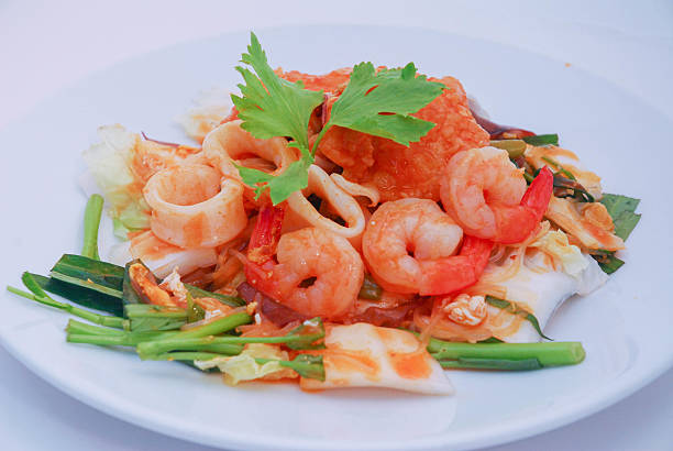 Thai spicy seafood salad with prawn and squid
