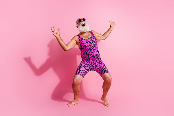 Full length photo of charismatic elderly cool man dance crazy good mood excited wear leopard print overall isolated pink color background Full length photo of charismatic elderly cool man dance crazy good mood excited wear leopard print overall isolated pink color background. gay man men sunglasses party stock pictures, royalty-free photos & images
