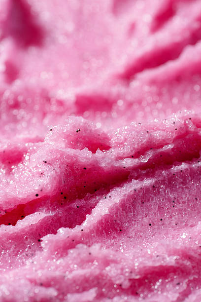 istock Pink raspberry fruit scrub texture close up. Fruity exfoliant with visible sugar granules. Natural body care exfoliating scrubber. Organic skincare cosmetic. 2217077494