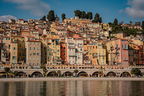 istock Panoramic View Of Menton On The French Riviera: Terracotta Rooftops, Sandy Beaches, Palm-Lined Promenade, And The Azure Mediterranean Sea Against A Backdrop Of Lush Green Hills And Mountains 2217078024