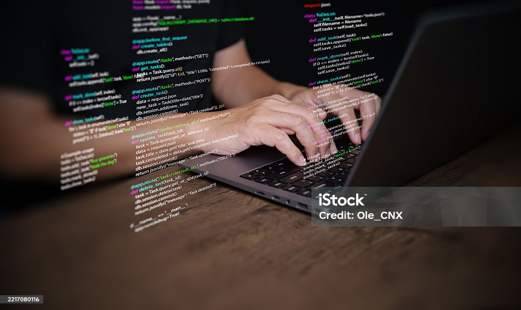 Hands Of A Programmer Types On A Laptop Displaying Programming Code ...