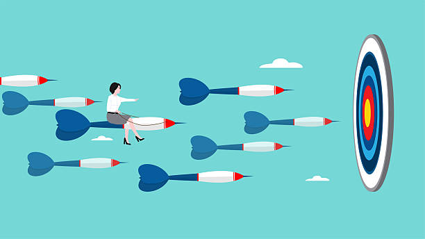 istock business or marketing target strategy, aim the target audience, introduce products or promotions to the right target audience, businesswoman control dart to reach perfect target 2217086205